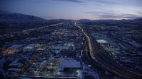 5.5K stock footage aerial video fly over shopping center, approach freeway with heavy traffic at twilight, Salt Lake City, Utah Aerial Stock Footage | AX128_066