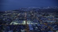 5.5K stock footage aerial video fly over West Temple toward State Street, Downtown SLC, Utah with winter snow at night Aerial Stock Footage | AX128_070