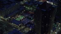 5.5K stock footage aerial video orbit office buildings and Gallivan Center, lit for Christmas in winter at night. Downtown SLC, Utah Aerial Stock Footage | AX128_095