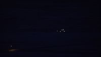 5.5K stock footage aerial video of tracking private jet descending to land at night in winter, Salt Lake City Airport, Utah Aerial Stock Footage | AX128_114