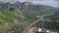 5.5K stock footage aerial video fly over suburban neighborhoods, approach Wasatch Range, Salt Lake City, Utah Aerial Stock Footage | AX129_088