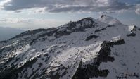 5.5K stock footage aerial video of passing by Lone Peak in snowy Wasatch Range, Utah Aerial Stock Footage | AX129_121