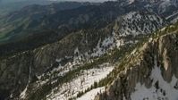 5.5K stock footage aerial video pan across Lone Peak in snowy Wasatch Range, Lone Peak, Utah Aerial Stock Footage | AX129_124