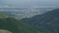 5.5K stock footage aerial video of flying over Wasatch Range to approach Downtown Salt Lake City, Utah Aerial Stock Footage | AX140_239