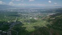 5.5K stock footage aerial video fly over Wasatch Range toward University of Utah and Downtown Salt Lake City, Utah Aerial Stock Footage | AX140_243