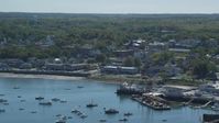 5.5K stock footage aerial video flying over harbor, approaching small coastal community, Plymouth, Massachusetts Aerial Stock Footage | AX143_087