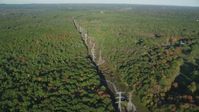 6k stock footage aerial video flying by decision forest, power lines, autumn, Walpole, Massachusetts Aerial Stock Footage | AX145_126