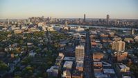 6k stock footage aerial video flying by office buildings, Downtown Boston skyline, Cambridge, Massachusetts, sunset  Aerial Stock Footage | AX146_047