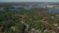 6k stock footage aerial video flying over autumn trees in a coastal town, New Castle, Portsmouth, New Hampshire Aerial Stock Footage | AX147_199