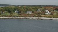 6k stock footage aerial video flying by oceanfront homes, Cushing Island, autumn, Portland, Maine Aerial Stock Footage | AX147_317