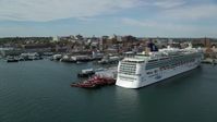 6k stock footage aerial video flying by docked cruise ship, piers and downtown, autumn, Portland, Maine Aerial Stock Footage | AX147_322