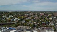 6k stock footage aerial video orbiting apartments, Saint Dominics Roman Catholic Church, autumn, Portland, Maine Aerial Stock Footage | AX147_325