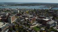 6k stock footage aerial video orbiting Portland Harbor, downtown buildings, autumn, Portland, Maine Aerial Stock Footage | AX147_329