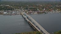 6k stock footage aerial video flying by Sagadohoc Bridge, small town, autumn, Bath, Maine Aerial Stock Footage | AX147_413