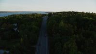 5.5K stock footage aerial video flying over road, approach church, cemetery, autumn, Stockton Springs, Maine, sunset Aerial Stock Footage | AX149_126
