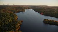 5.5K stock footage aerial video flying over Quantabacook Lake, forest, autumn, Searsmont, Maine, sunset Aerial Stock Footage | AX149_172