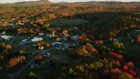 5.5K stock footage aerial video orbiting small rural town near colorful forest, autumn, Searsmont, Maine, sunset Aerial Stock Footage | AX149_177