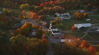 5.5K stock footage aerial video orbiting small rural town, church, autumn, Searsmont, Maine, sunset Aerial Stock Footage | AX149_181