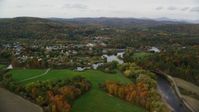5.5K stock footage aerial video flying over Ammonoosuc River, approach small rural town, autumn, Woodsville, New Hampshire Aerial Stock Footage | AX150_284