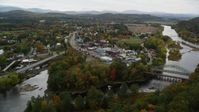 5.5K stock footage aerial video flying by rural town, bridge, Ammonoosuc River and Connecticut River, autumn, Woodsville, New Hampshire Aerial Stock Footage | AX150_286