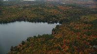5.5K stock footage aerial video approaching waterfront homes, Perkins Pond, forest, autumn, Sunapee, New Hampshire Aerial Stock Footage | AX151_077