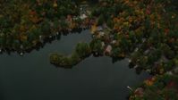 5.5K stock footage aerial video of a bird's eye view over Perkins Pond, homes, colorful forest, autumn, Sunapee, New Hampshire Aerial Stock Footage | AX151_078