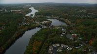 5.5K stock footage aerial video orbiting small bridges, Merrimack River, small town, autumn, Hooksett, New Hampshire Aerial Stock Footage | AX152_013