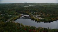 5.5K stock footage aerial video orbiting small town, homes, small bridges, Merrimack River, autumn, Hooksett, New Hampshire Aerial Stock Footage | AX152_015