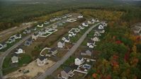 5.5K stock footage aerial video flying by tract homes, colorful foliage in autumn, Hooksett, New Hampshire Aerial Stock Footage | AX152_020
