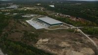 5.5K stock footage aerial video over quarry, approach warehouse building, autumn, Hooksett, New Hampshire Aerial Stock Footage | AX152_029
