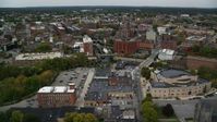 5.5K stock footage aerial video flying over a canal toward factory buildings, autumn, Lowell, Massachusetts Aerial Stock Footage | AX152_134