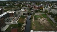 5.5K stock footage aerial video flying over canal toward locks and dam, autumn, Lowell, Massachusetts Aerial Stock Footage | AX152_136