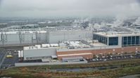 5.5K stock footage aerial video of the Intel manufacturing plant at Intel Ronler Acres Campus and low clouds, autumn, Hillsboro, Oregon Aerial Stock Footage | AX153_001