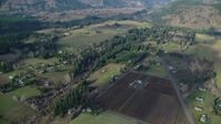 5.5K stock footage aerial video flying over rural farms in Parkdale, Oregon Aerial Stock Footage | AX154_142