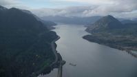5.5K stock footage aerial video flying over the Columbia River to approach I-84 in the Columbia River Gorge Aerial Stock Footage | AX154_158