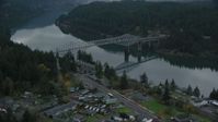 5.5K stock footage aerial video flying over small town RV park and hotel to approach the Bridge of the Gods, Cascade Locks, Oregon in Columbia River Gorge Aerial Stock Footage | AX154_172