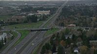5.5K stock footage aerial video following Highway 26 with light traffic through Hillsboro, Oregon, twilight Aerial Stock Footage | AX155_128
