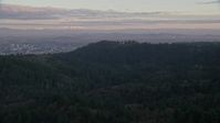 5.5K stock footage aerial video of Mount Hood and Downtown Portland at sunset, seen from forest and hills in Northwest Portland, Oregon Aerial Stock Footage | AX155_139