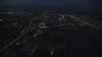 5.5K stock footage aerial video following I-5 freeway, Downtown Portland cityscape, bridges on the Willamette River at night, Oregon Aerial Stock Footage | AX155_290