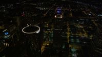 4.8K stock footage aerial video approaching skyscrapers, tilt to bird's eye of 191 Peachtree, Downtown Atlanta, Georgia, night Aerial Stock Footage | AX41_065E