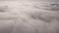 4K stock footage aerial video flying by a dense, sunlit marine layer, Los Angeles, California Aerial Stock Footage | AX43_051