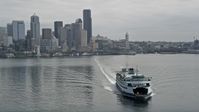 5K stock footage aerial video tracking a ferry sailing away from Downtown Seattle skyline, Washington Aerial Stock Footage | AX45_021E