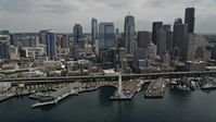 5K stock footage aerial video approaching the skyline and Waterfront, and tilt down to the Great Wheel, Downtown Seattle, Washington Aerial Stock Footage | AX45_049