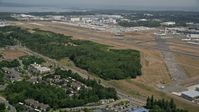 5K stock footage aerial video approach the runways of Paine Field, and the Boeing Factory, Everett, Washington Aerial Stock Footage | AX45_130E
