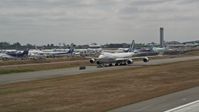 5K stock footage aerial video of tracking a 747 taxiing down a runway, Paine Field, Washington Aerial Stock Footage | AX45_147