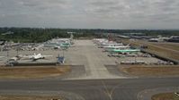 5K stock footage aerial video of rows of commercial airplanes parked at Paine Field, Washington Aerial Stock Footage | AX45_150