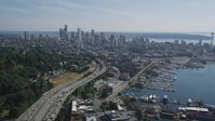 5K stock footage aerial video of following heavy traffic traveling Interstate 5 to approach Downtown Seattle skyline, Washington Aerial Stock Footage | AX47_092