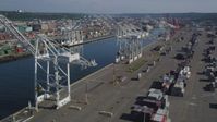 5K stock footage aerial video of cargo cranes on either side of the Duwamish Waterway at Harbor Island, Seattle, Washington Aerial Stock Footage | AX47_100