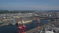 5K stock footage aerial video of cargo cranes and an empty cargo ship docked at Harbor Island, Seattle, Washington Aerial Stock Footage | AX47_102