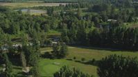 5K stock footage aerial video fly over the Blue Heron Golf Course to approach the Snoqualmie River in Carnation, Washington Aerial Stock Footage | AX48_035